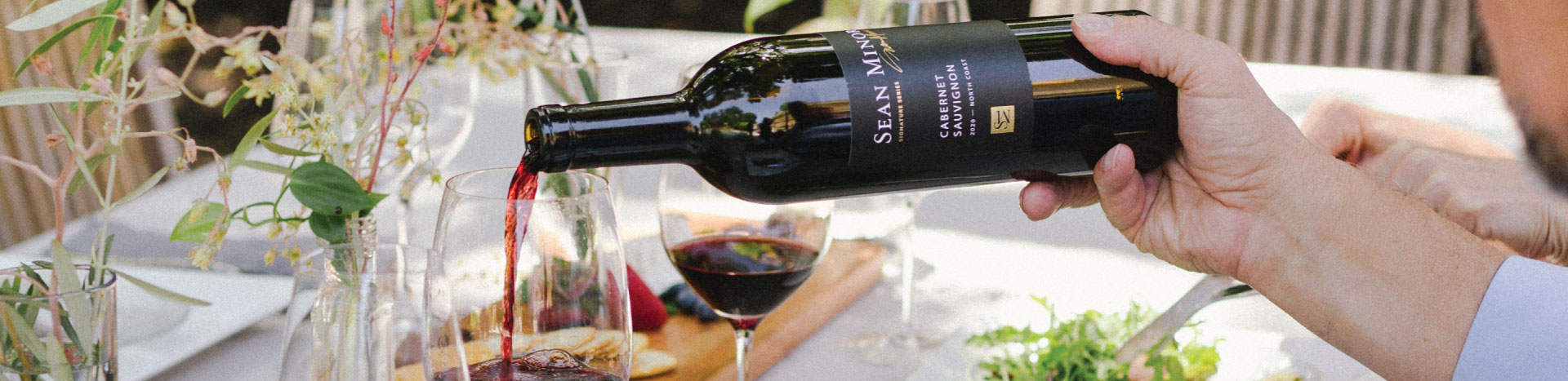 red wine being poured in to a wine glass