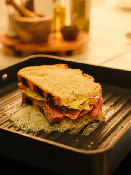 Cooking corned beef sandwich on grill pan