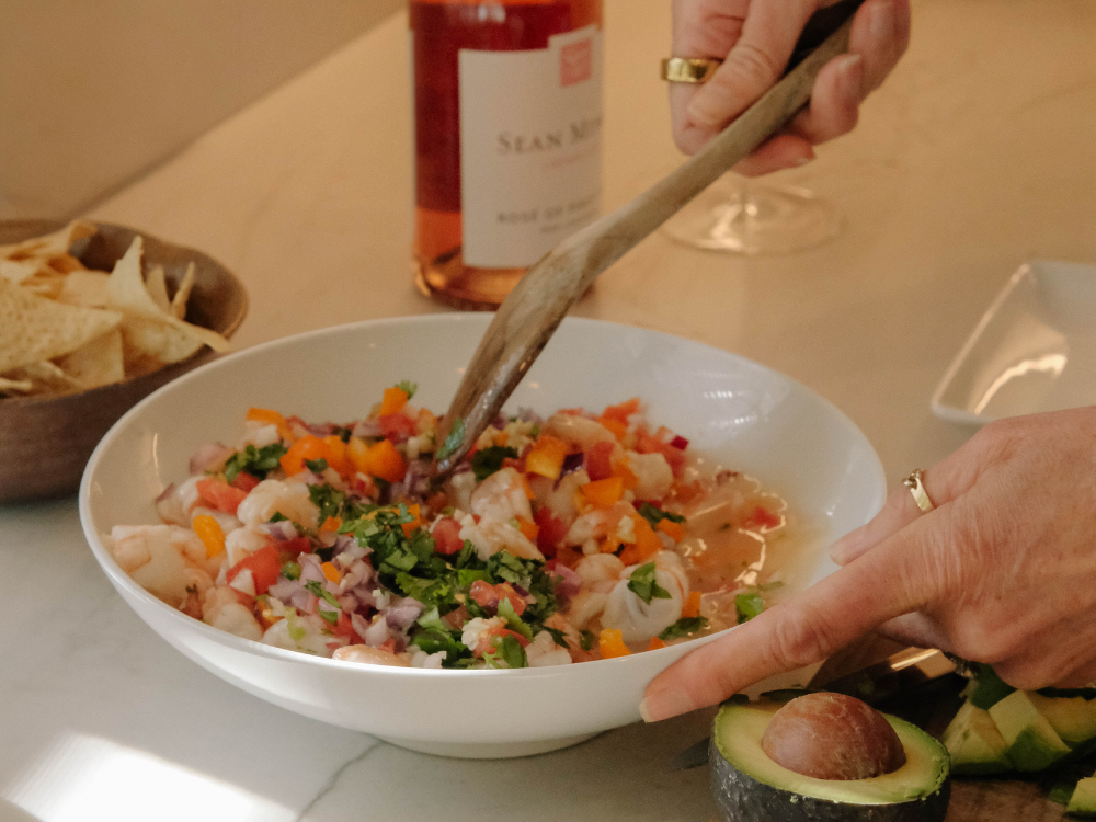 wooden spoon stirring ceviche