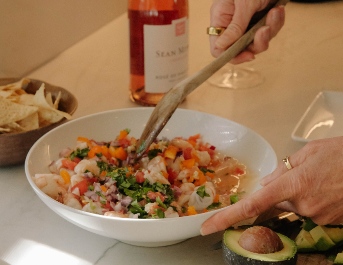wooden spoon stirring ceviche