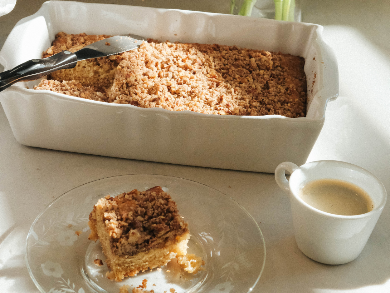 slice of coffee cake and tray of coffee cake