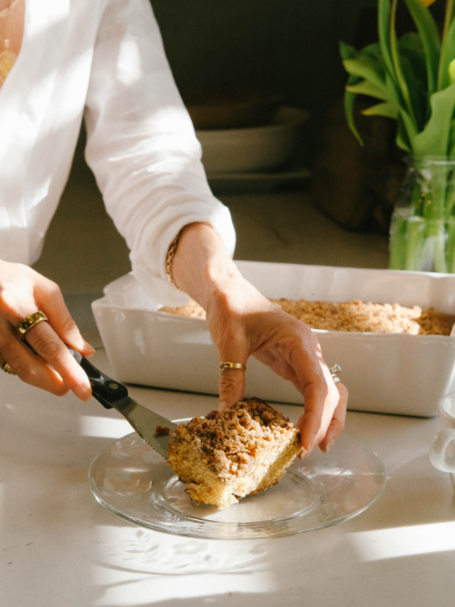 nicole slicing a piece of coffee cake