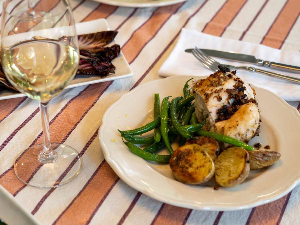 fennel chicken plate with glass of wine
