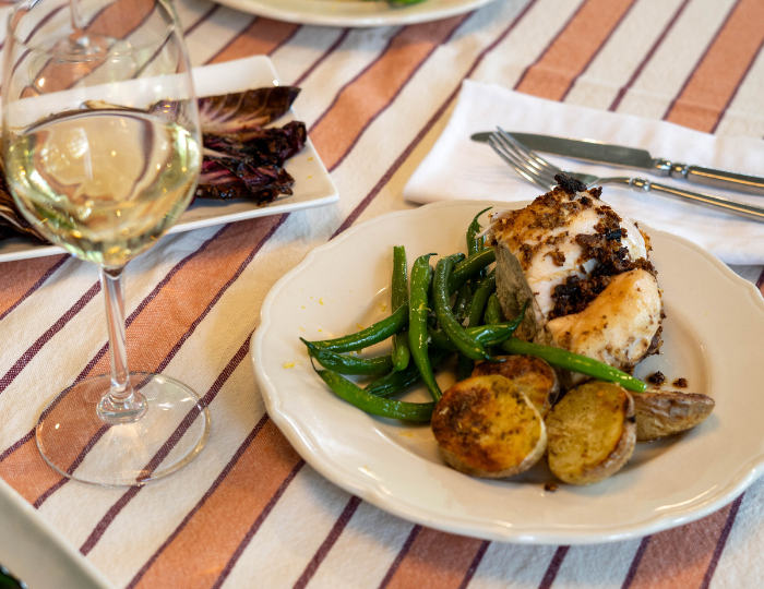 fennel chicken plate with glass of wine