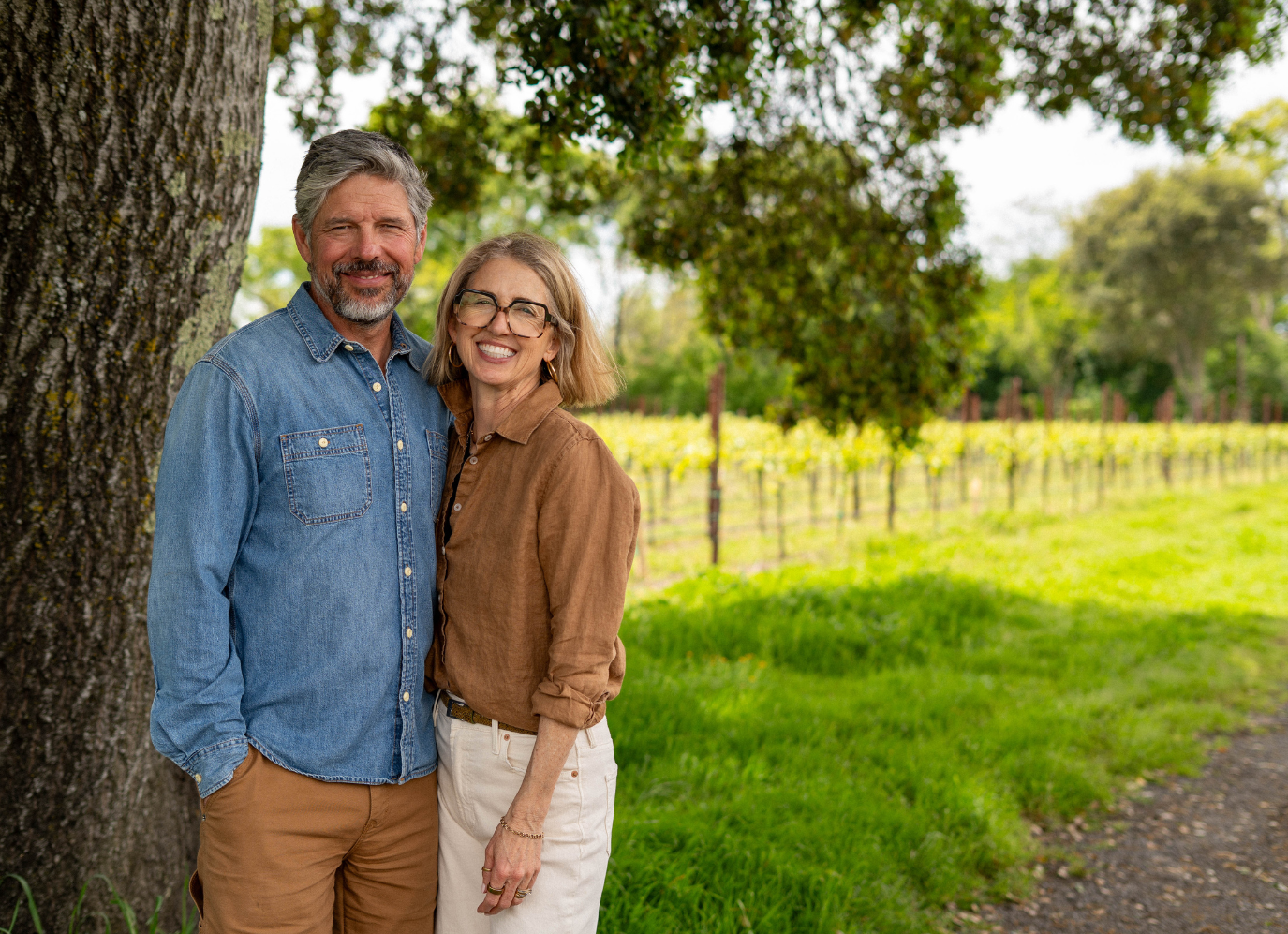 Sean and Nicole standing in Sonoma VIneyards