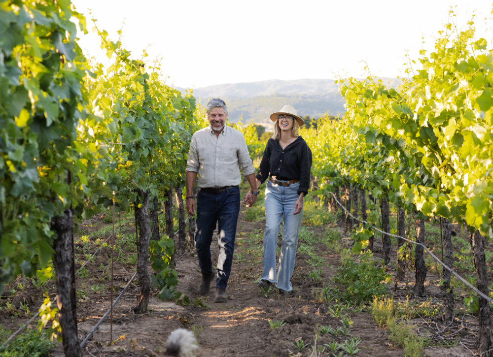 Sean and Nicole Walking in Vineyard